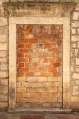 Brick background from old house in Montenegro