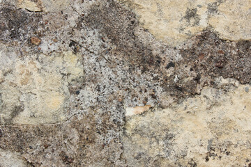 Old wall with shabby damaged plaster. Texture, pattern, background. Copy space.