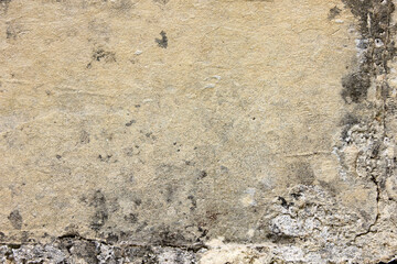 Old wall with shabby damaged plaster. Texture, pattern, background. Copy space.
