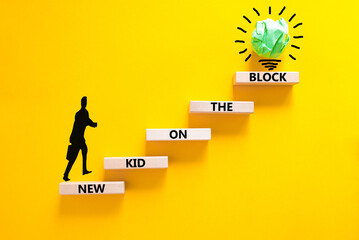 New kid on the block symbol. Concept words New kid on the block on wooden blocks. Businessman icon....