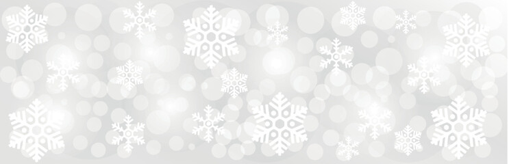 Blurred Christmas lights with snowflakes on grey background
