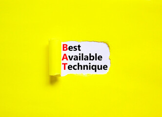 BAT best available technique symbol. Concept words BAT best available technique on white paper on a beautiful yellow background. Business and BAT best available technique concept. Copy space.