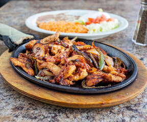 Chicken Fajitas with rice and beans Mexican food