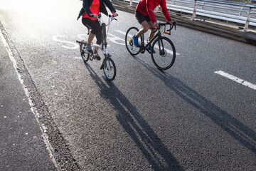 Fototapeta na wymiar two person riding bicycle on a city street