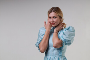 Beautiful woman in vintage blue dress