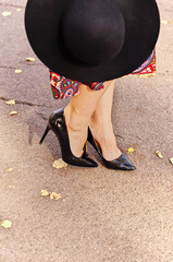 legs of a person with a hat