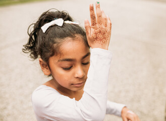 Little girl showing her henna 