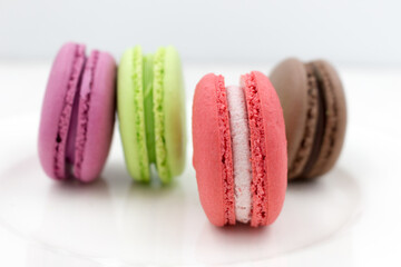 Delicious sweet light macaron dessert. Round multicolored pie.