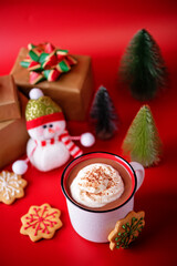 Winter Christmas holidays background with Cup of cocoa or hot chocolate with whipped cream with cinnamon sprinkles