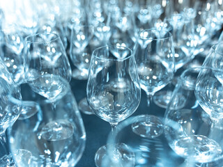 Wine glasses. Horizontal photo of aligned empty wine glasses, close up, black and white. Selective focus. High quality photo