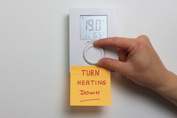 turn heating down note on a home thermostat 