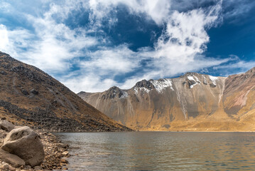 View inside of Volcano Nevado de Toluca National park with lakes inside the crater in Mexico in the morning blue sky - landscape near of Mexico City - Xinantecatl