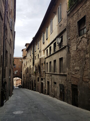 A typical street in a Tuscan town on a sunny summer day.