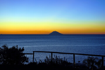 sunset of the volcano Stromboli seen from capo vaticano italy