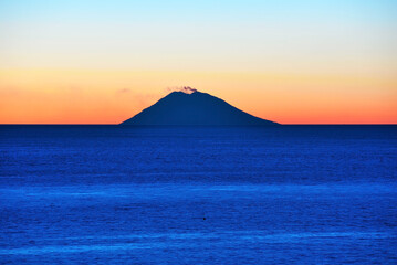 sunset of the volcano Stromboli seen from capo vaticano italy