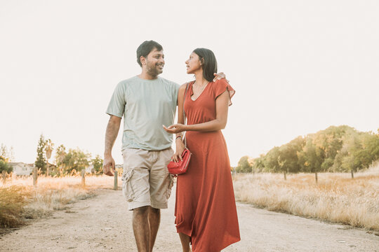 Father walking outdoors with his teen daughter