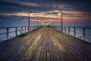 Fototapeta premium Baltic Sea pier in Gdynia Orlowo at sunrise, Poland