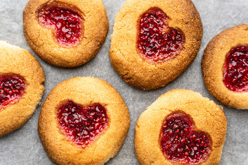 Homemade cookies decorated with raspberry jam in the shape of a heart