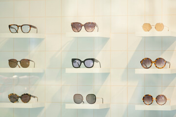 Exhibitor of glasses consisting of shelves of fashionable glasses shown at the optical shop