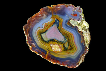 A cross section of the agate stone. Multicolored agate with a unique contrasting pattern and...