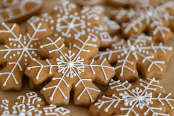 New Year's traditional gingerbread cookies decorated with sugar white icing close-up
