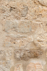 ancient stone wall texture background in vertical view
