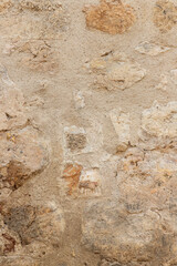 ancient stone wall texture background in vertical view