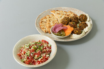 Falafel served with bread and vegetables