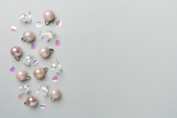 Christmas balls on color background, top view