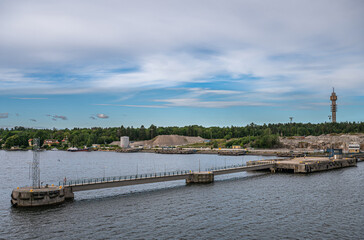 Sweden, Stockholm - July 16, 2022: Ex-Mobil pier with construction site behind in Frihamnen Port....