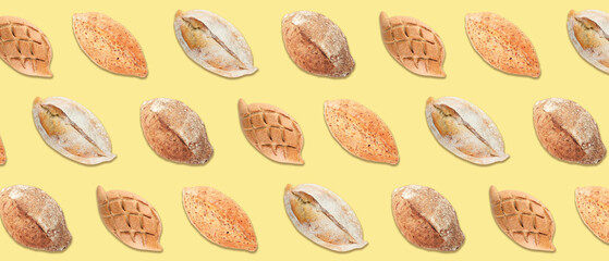 Many loaves of bread on yellow background. Banner for design