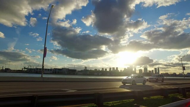 Point Of View Vehicles Moving On Road By Lake In City Under Cloudy Sky During Sunset - Charlotte, North Carolina