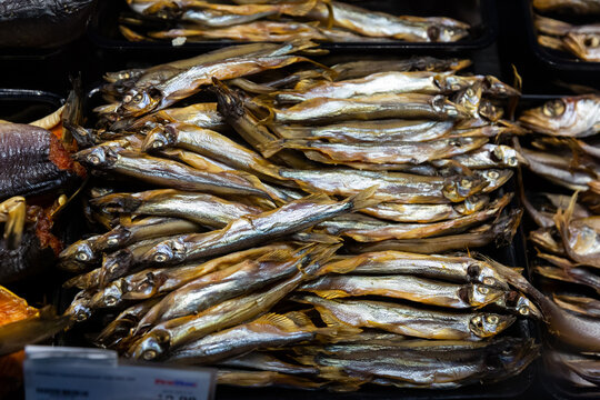 Cured herring and other fish in supermarket. High quality photo