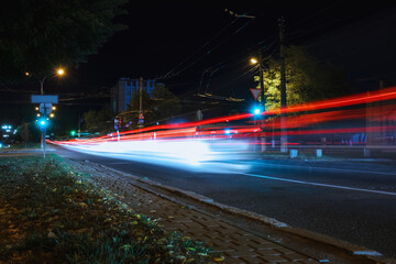 Fototapeta premium View of city road with street lights at night