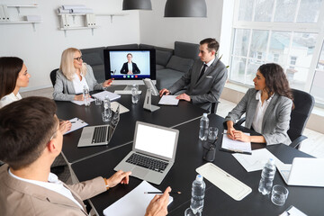 Business people having online meeting in office