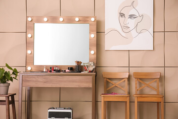 Modern makeup artist's workplace near color wall in room