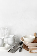 Fototapeta na wymiar Set of different dishware and kitchenware on white table