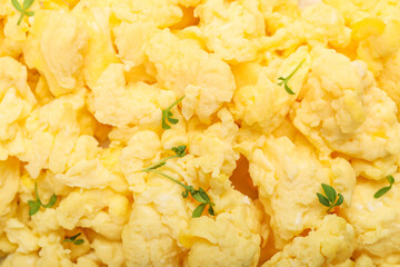 Texture of tasty scrambled eggs as background, closeup