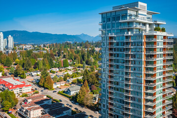 Naklejka premium Aerial view of Coquitlam skyline and residential apartment buildings. Taken in Greater Vancouver BC Canada