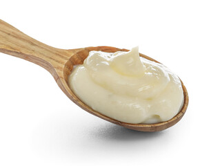 Wooden spoon of tasty vanilla pudding on white background, closeup