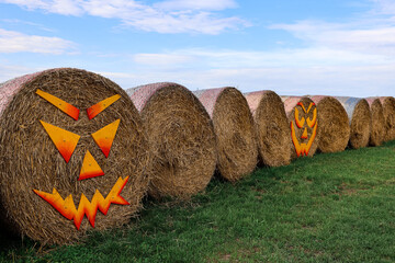 Haystacks decorated for Halloween at farm