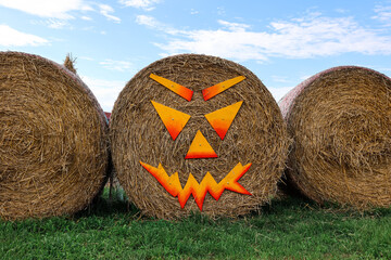 Haystacks decorated for Halloween at farm