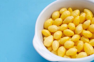 Boiled ginkgo nuts on blue background.