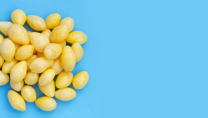 Boiled ginkgo nuts on blue background.