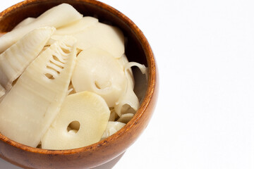 Preserved bamboo shoot slices on white background