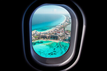 Cancun beach view from jet plane window