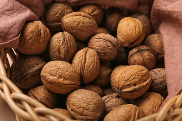 Basket with fresh walnuts, closeup