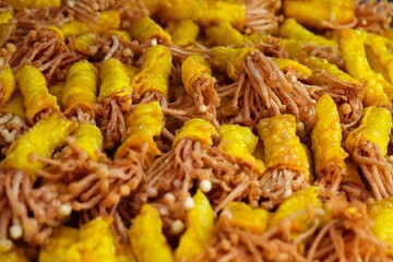 Golden needle mushroom wrapped in dumpling sheet then fried to crispy