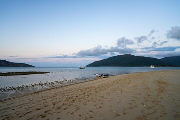 tourist boats and tour boats in the whitsundays queensland, australia. travellers on the great barrier reef, over coral and fish. tourism yachts of young people partying on the water