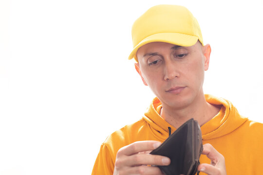 Latino man holding a wallet with no money